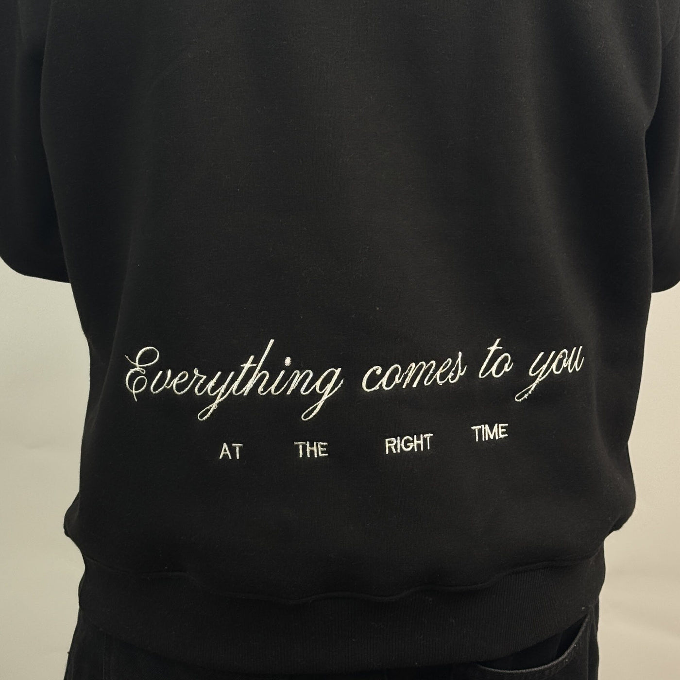 Art District Hoodie in Black — back embroidery detail