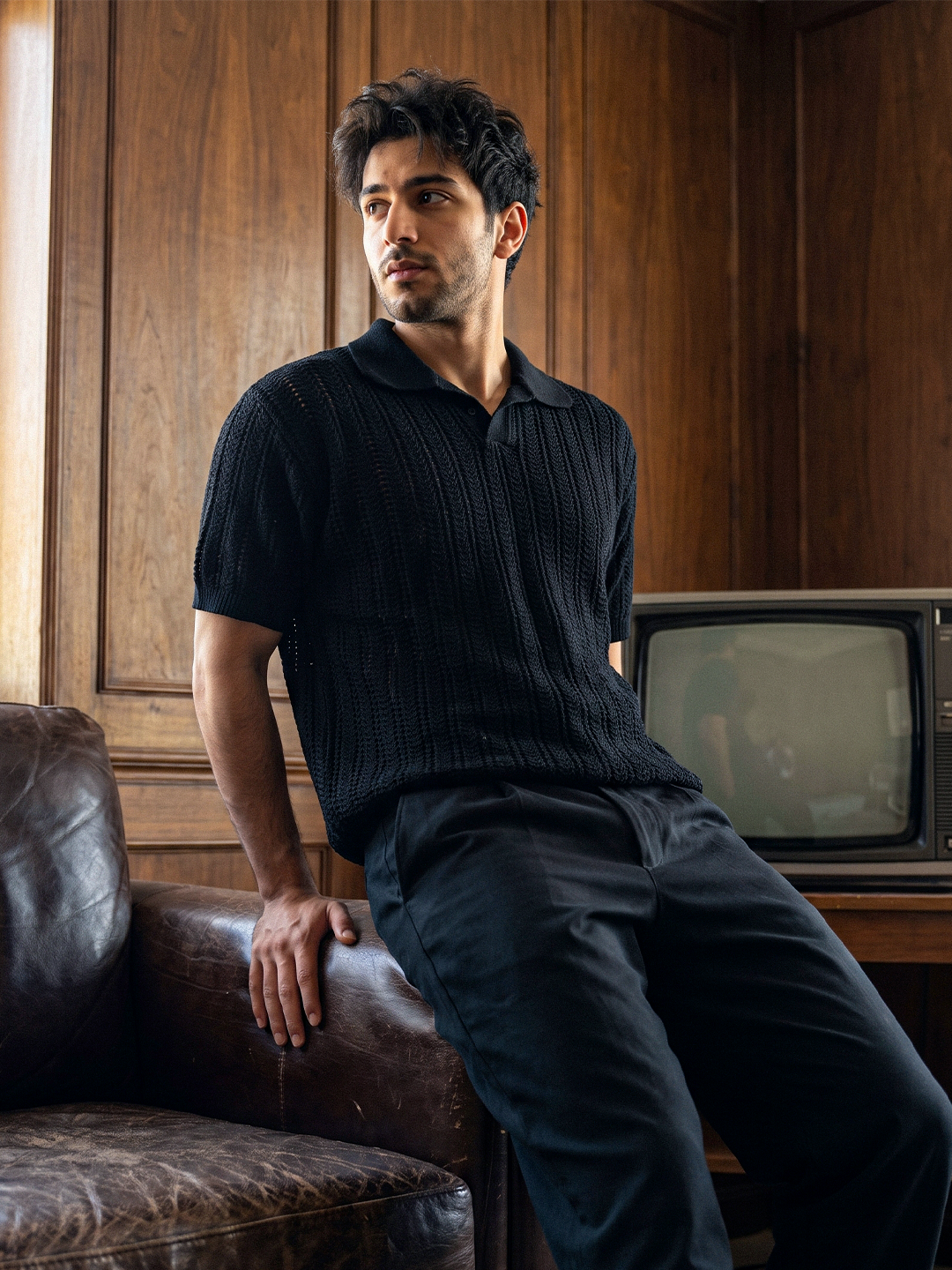 Knitted polo black lifestyle image